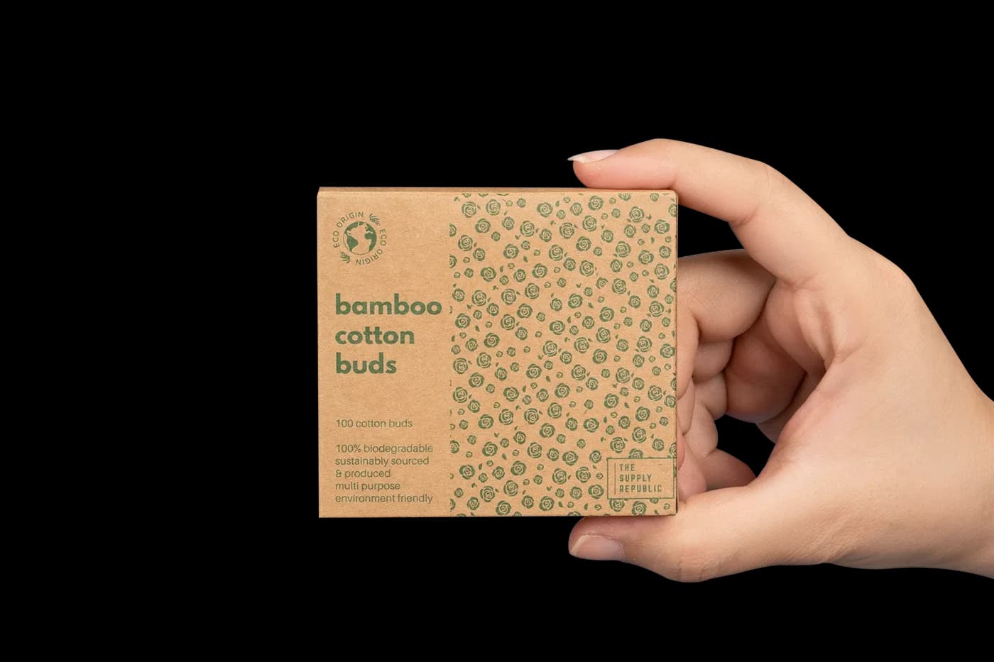 Hand holding a small box of bamboo cotton buds