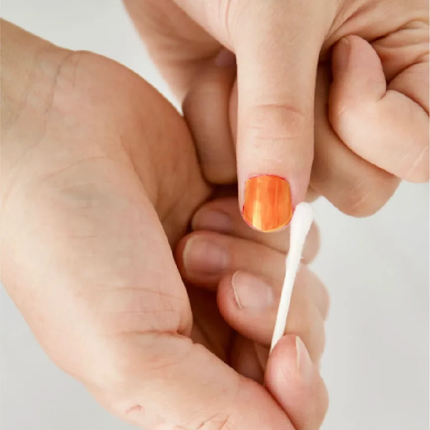 Cotton bud tidying painted nails