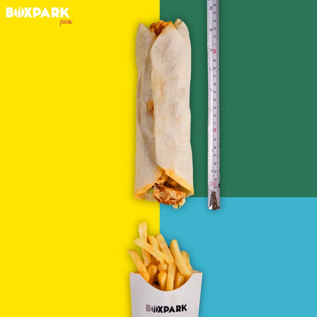 Long wrap next to a tape measure, with fries in a BoxPark cup below