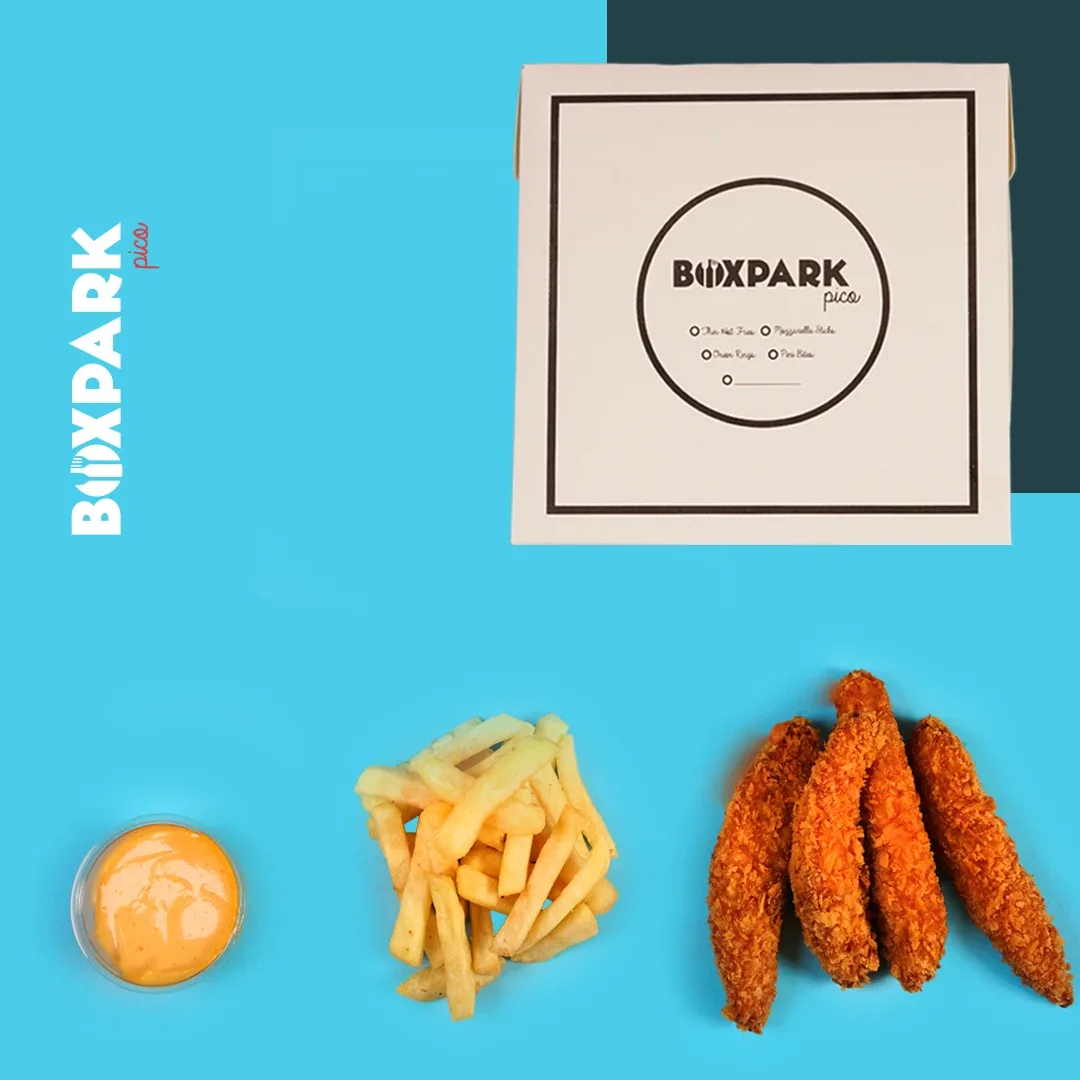 Chicken strips, fries and dip below a BoxPark Pico box on blue