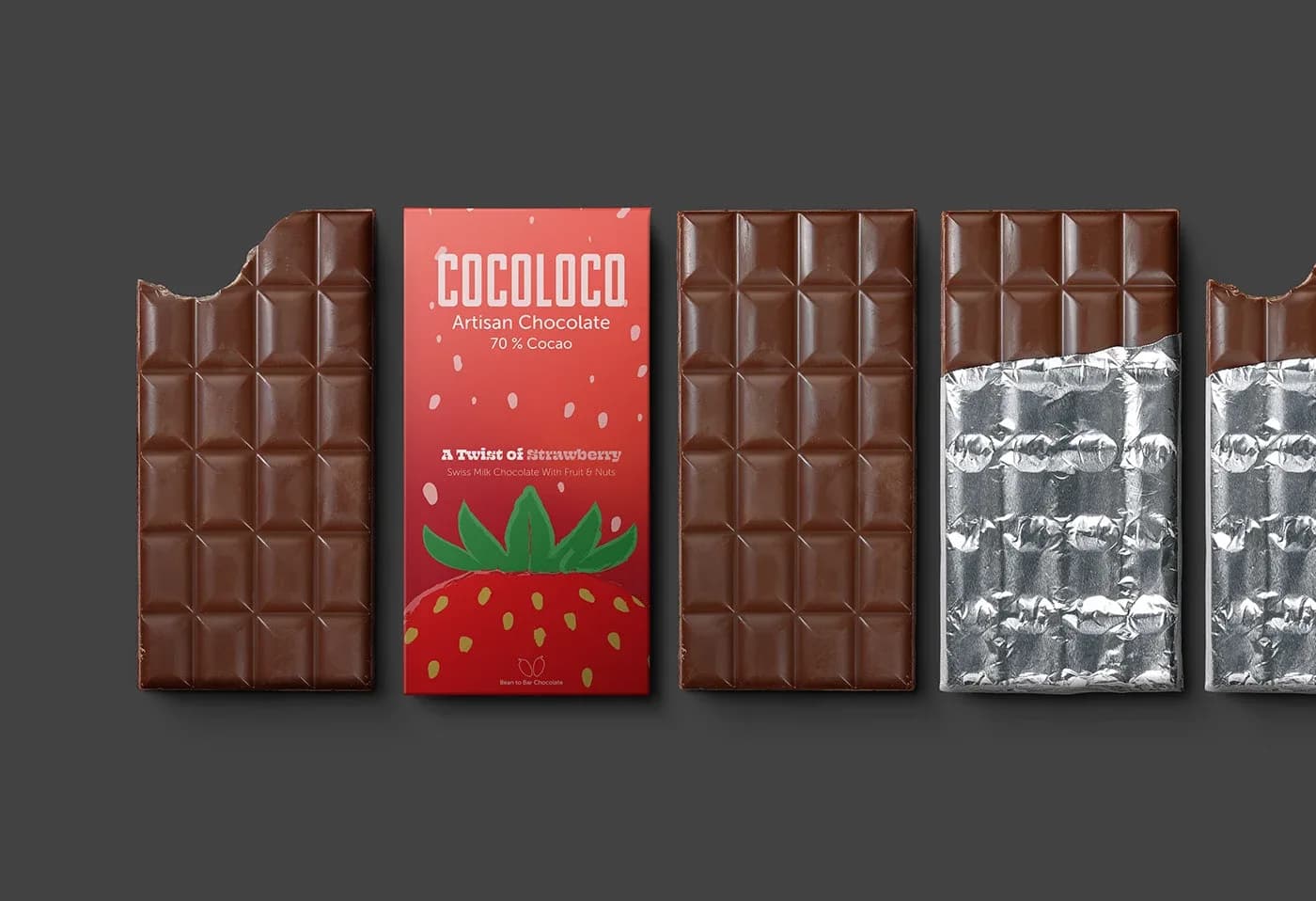 Red CocoLoco strawberry chocolate wrapper beside unwrapped and foil-wrapped bars