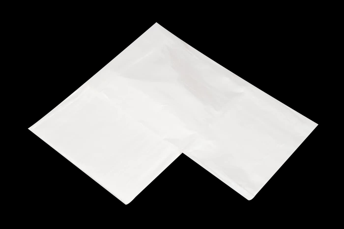 Two folded dust sheets overlapping on black