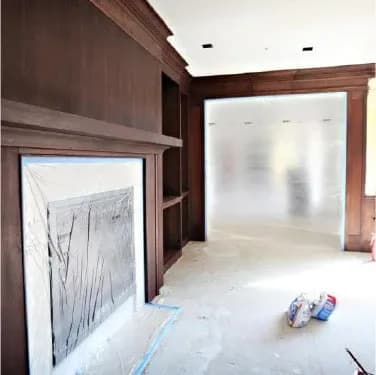Fireplace and doorway sealed with plastic sheeting