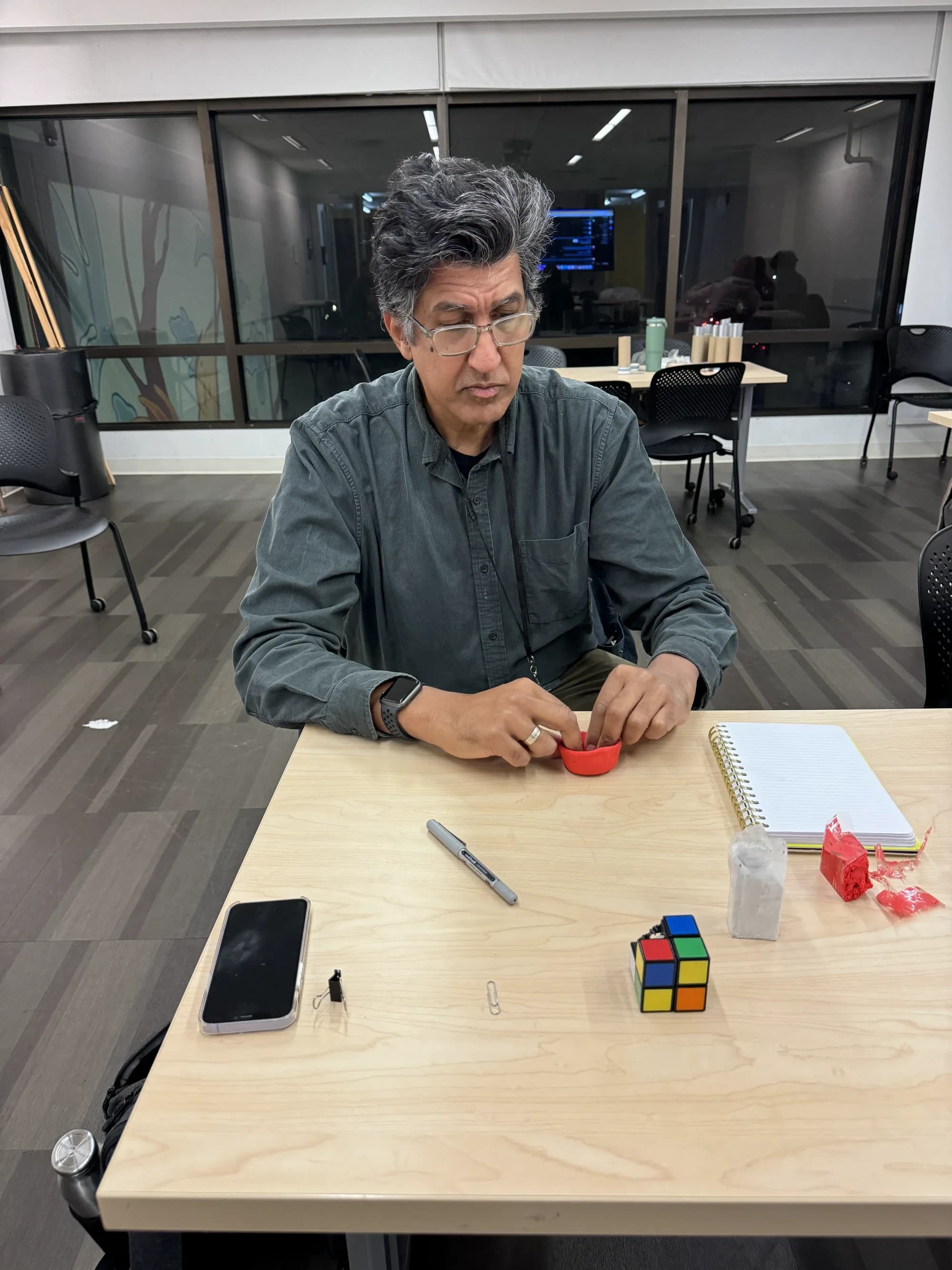 Workshop participant modeling red clay