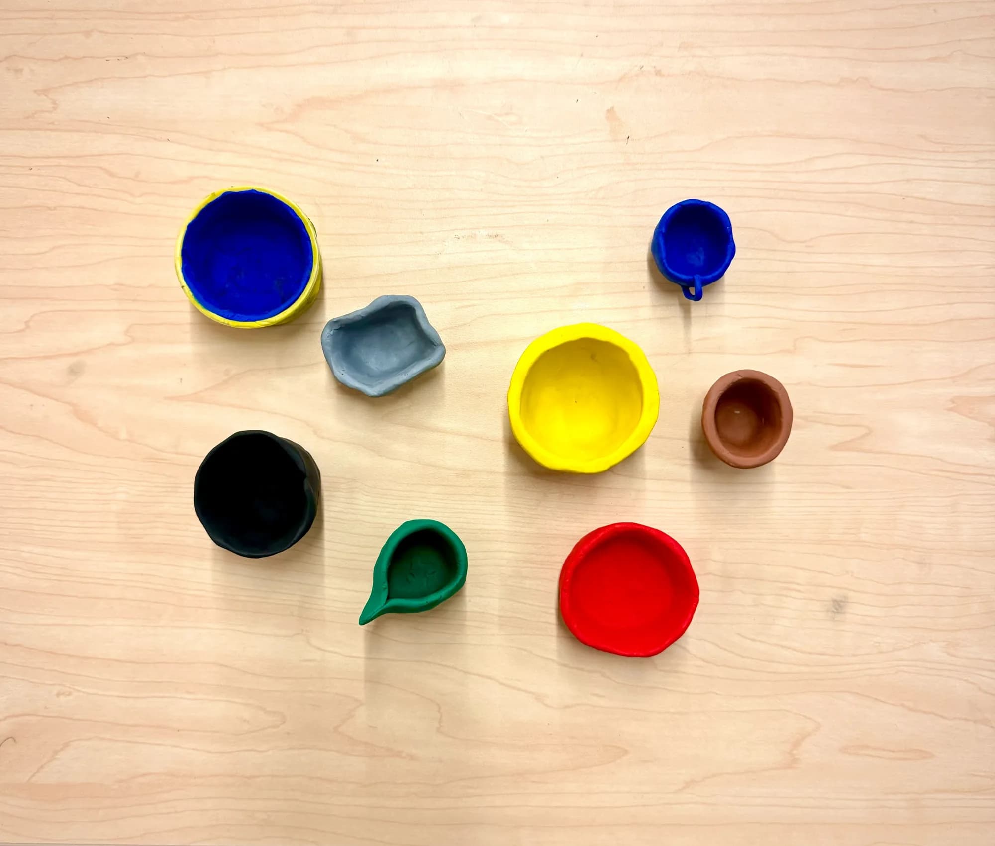 Colorful clay bowls made during the workshop
