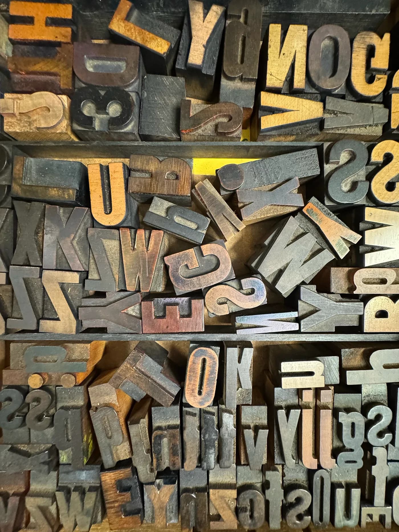 Assorted wood type letters in a type case