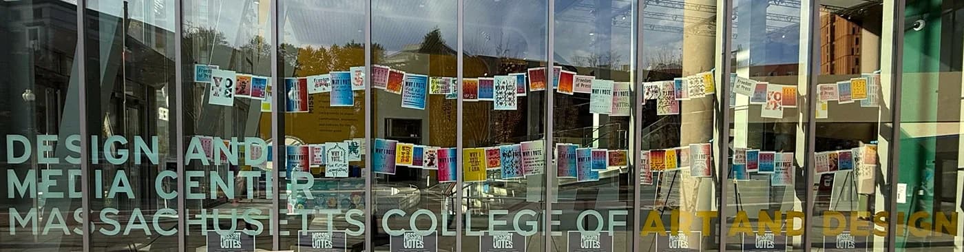Row of voting posters across the Design and Media Center windows