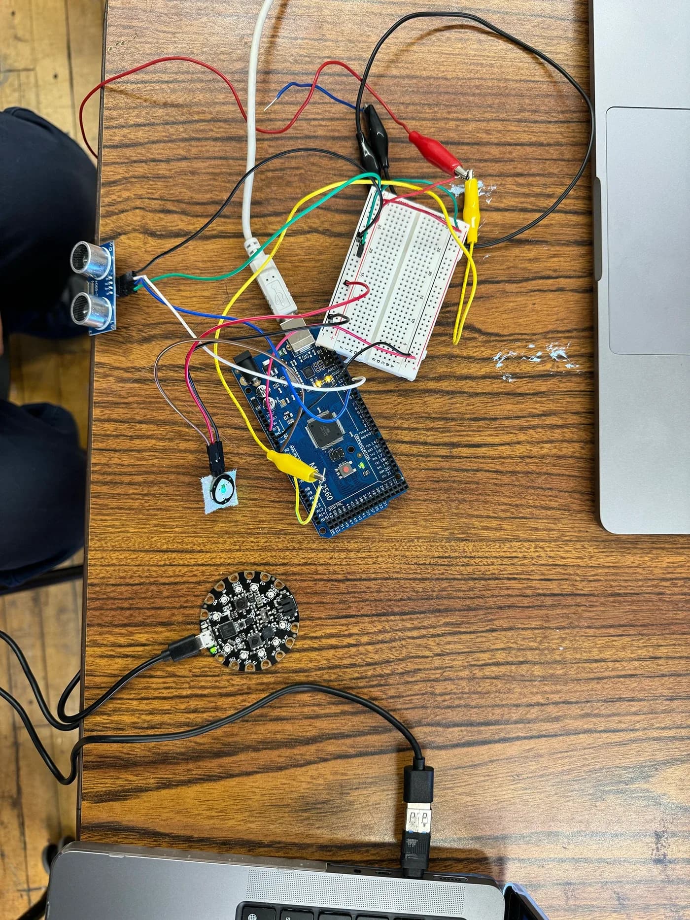 Breadboard, Arduino and Circuit Playground wired on a desk