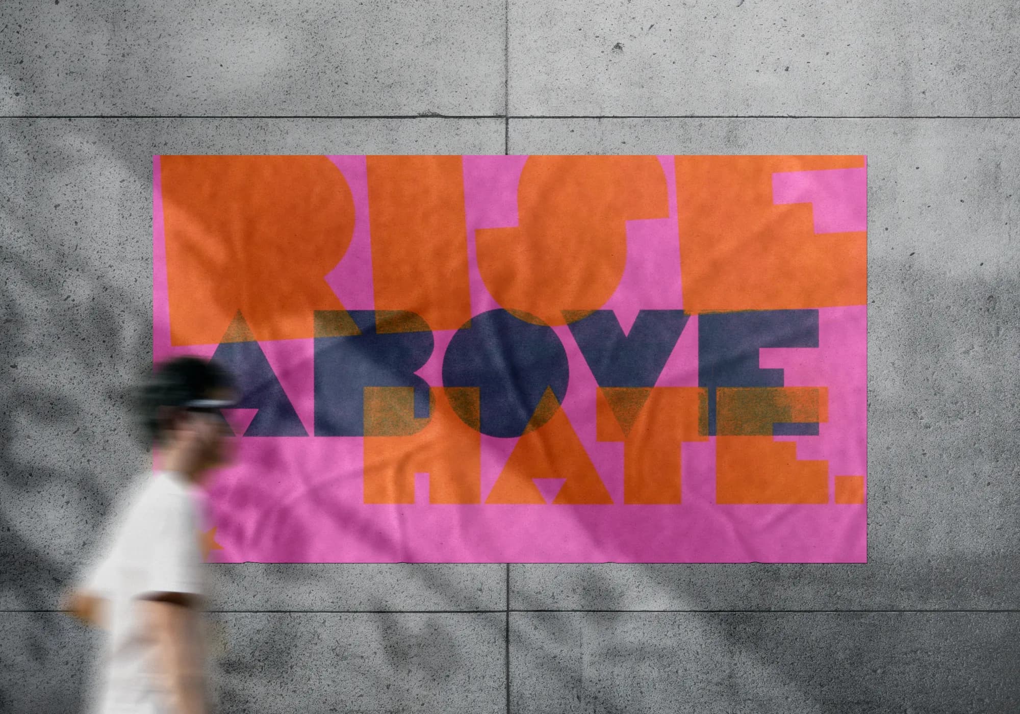 Orange and navy Rise Above Hate poster on pink paper, wall mockup