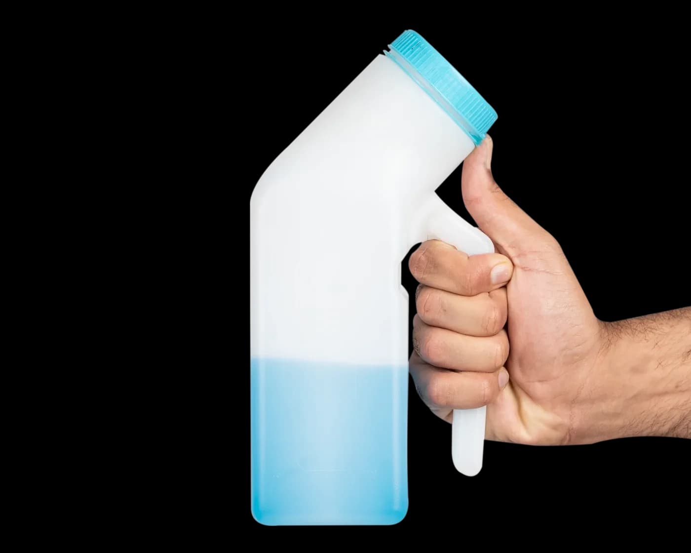 Hand gripping the upright bottle with blue liquid