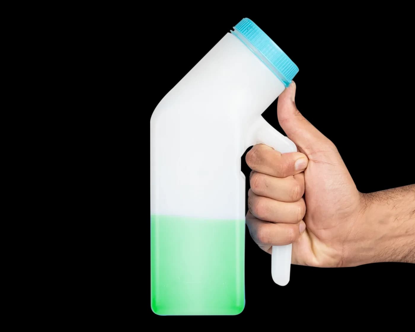 Hand gripping the bottle filled with green liquid