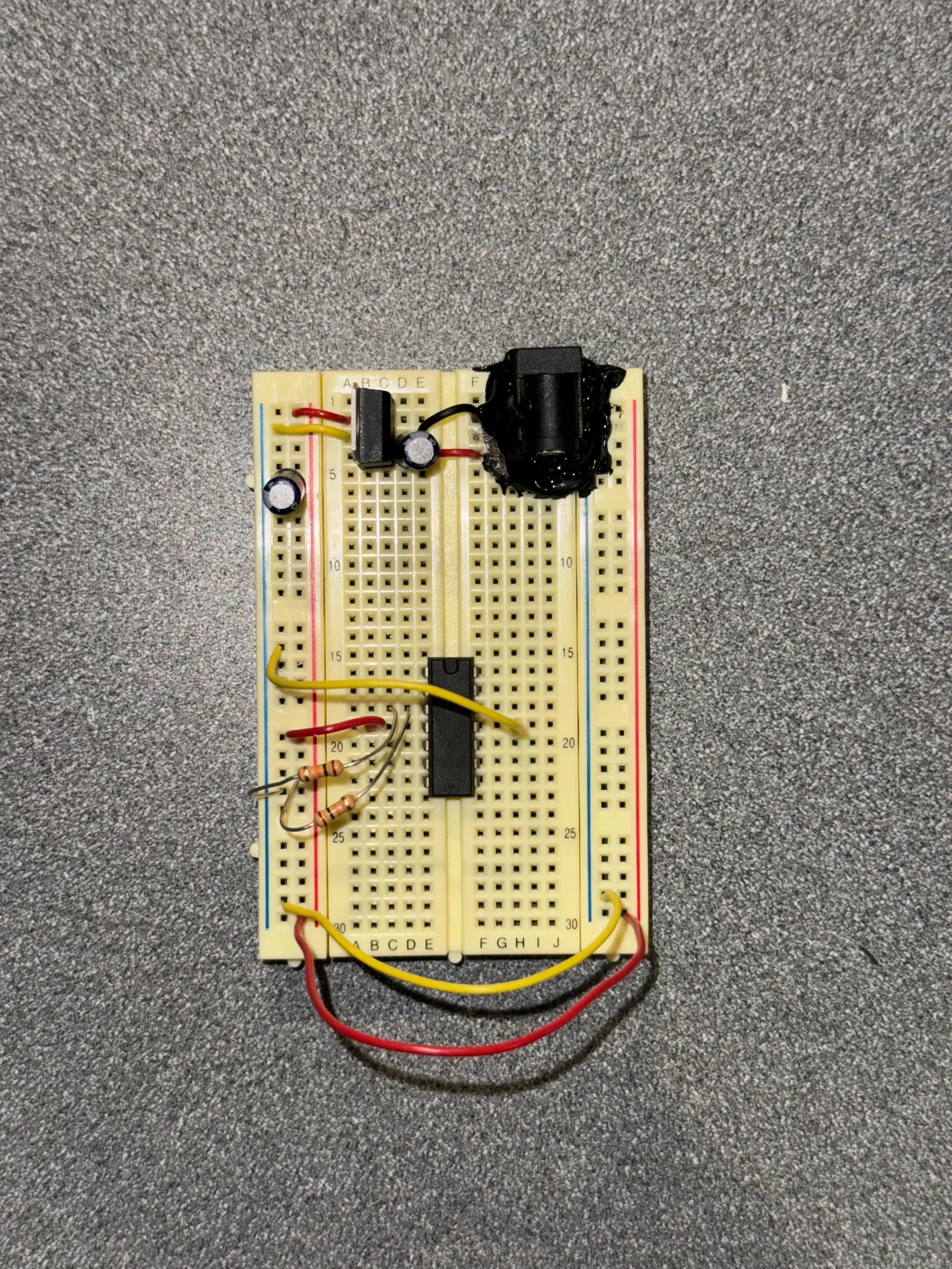 Top view of a breadboard circuit with an integrated chip