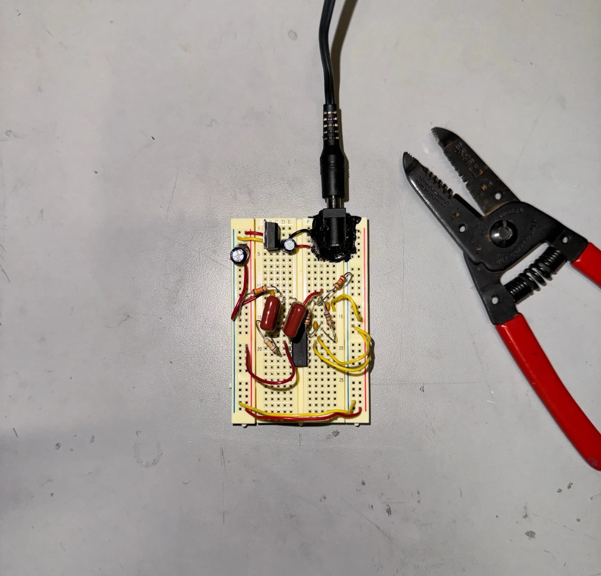 Breadboard filter circuit next to wire strippers