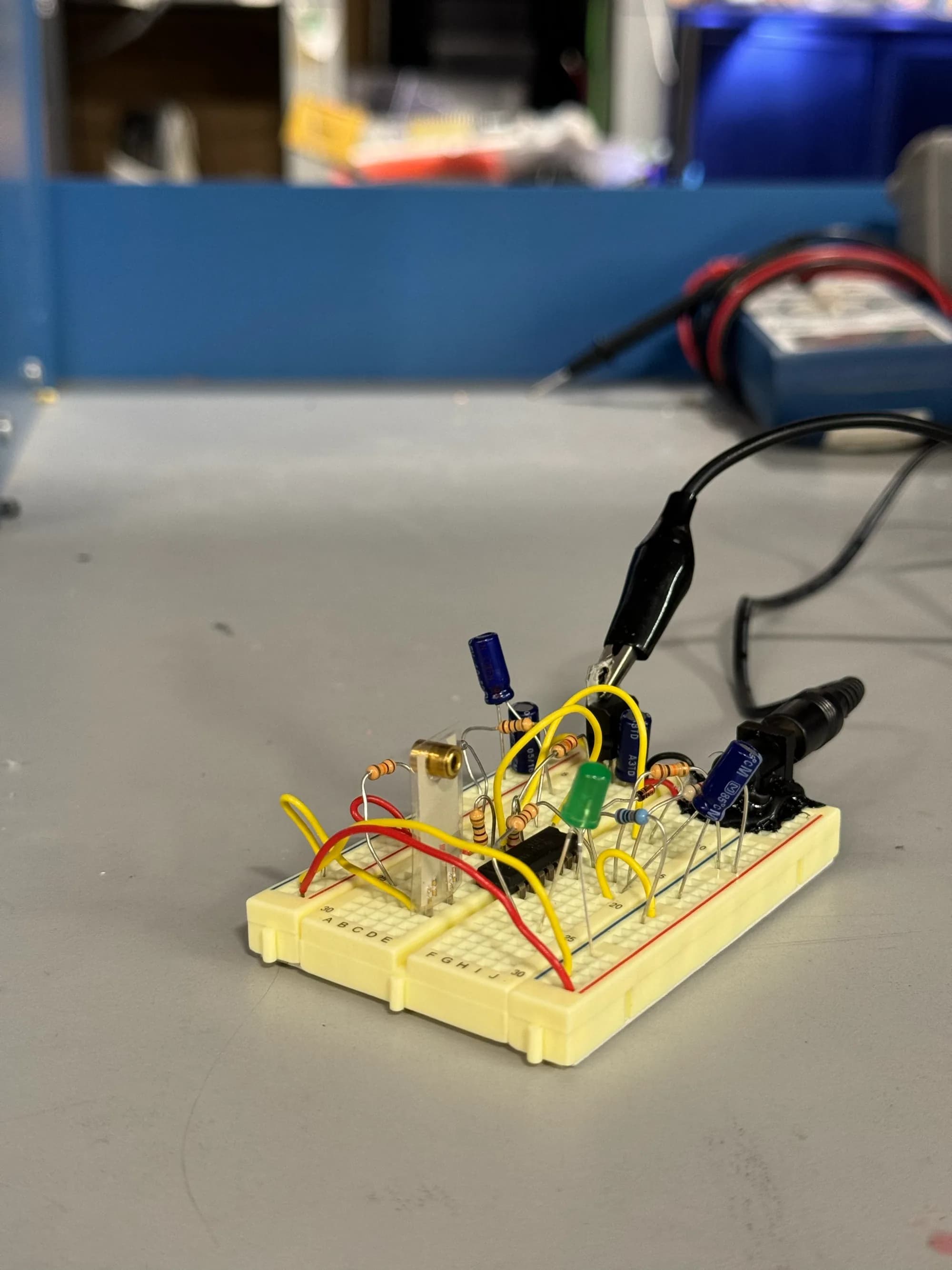 Breadboard circuit with capacitors and alligator clips