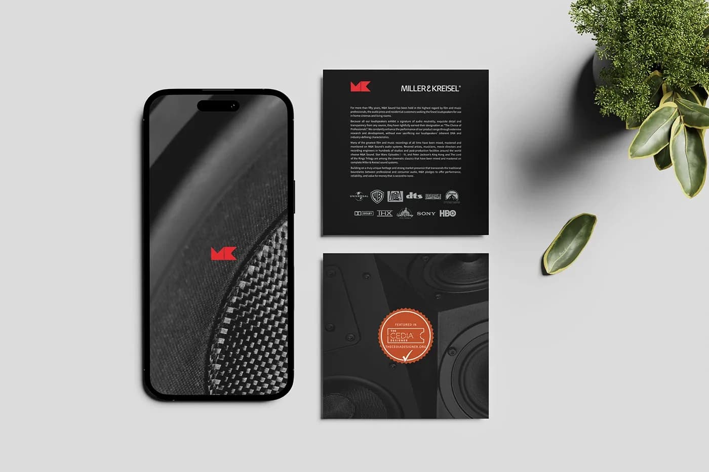 Dark MK Sound heritage post, CEDIA badge post and phone with red logo