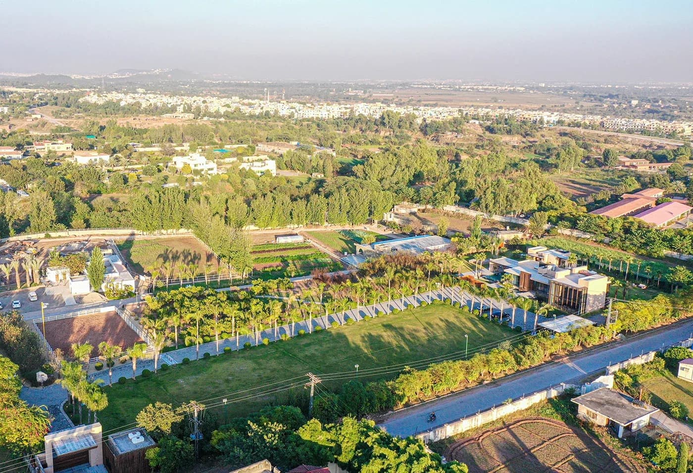 Wide aerial of the estate's lawns and farmland