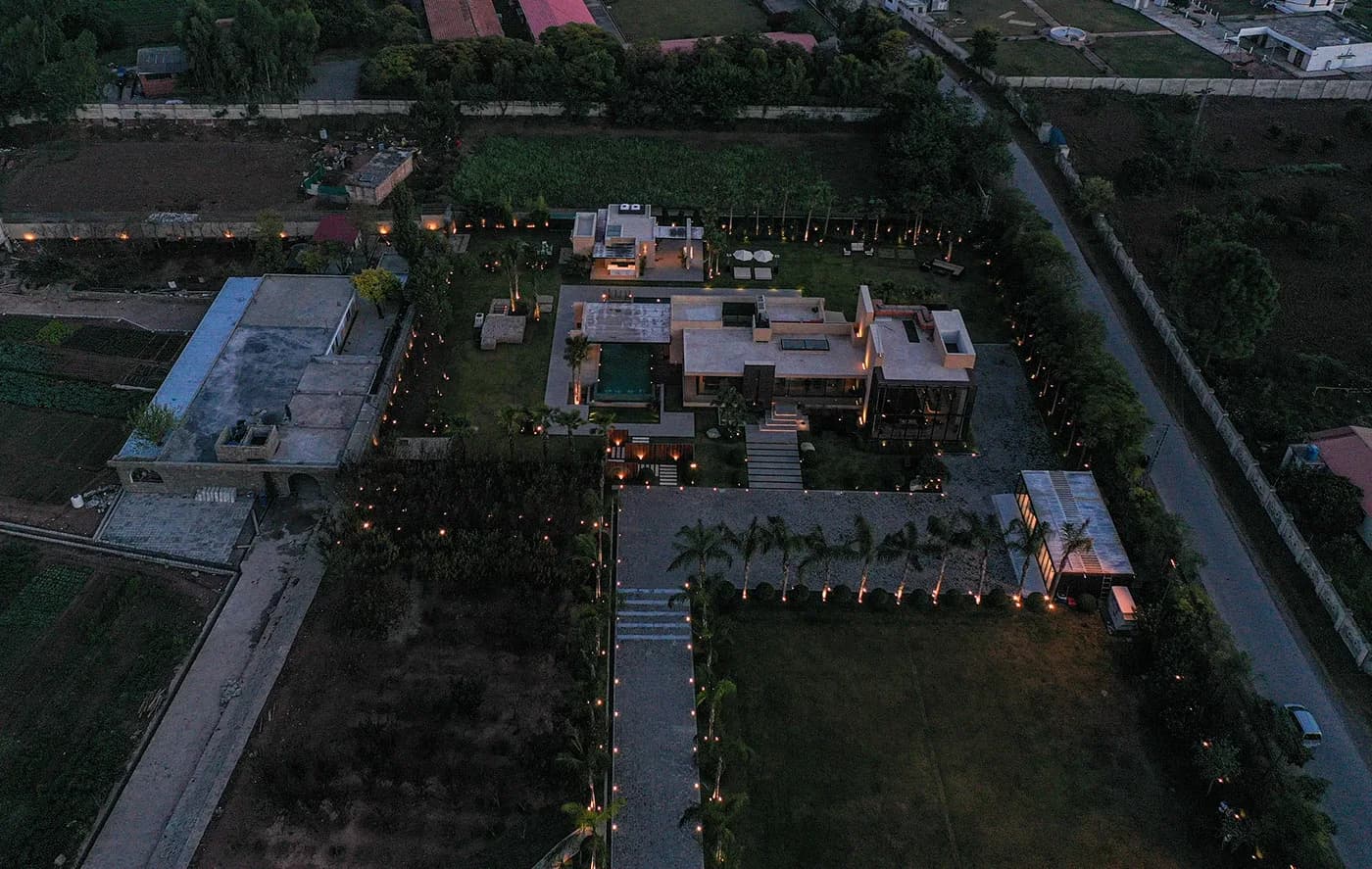 Aerial of the estate lit up at dusk