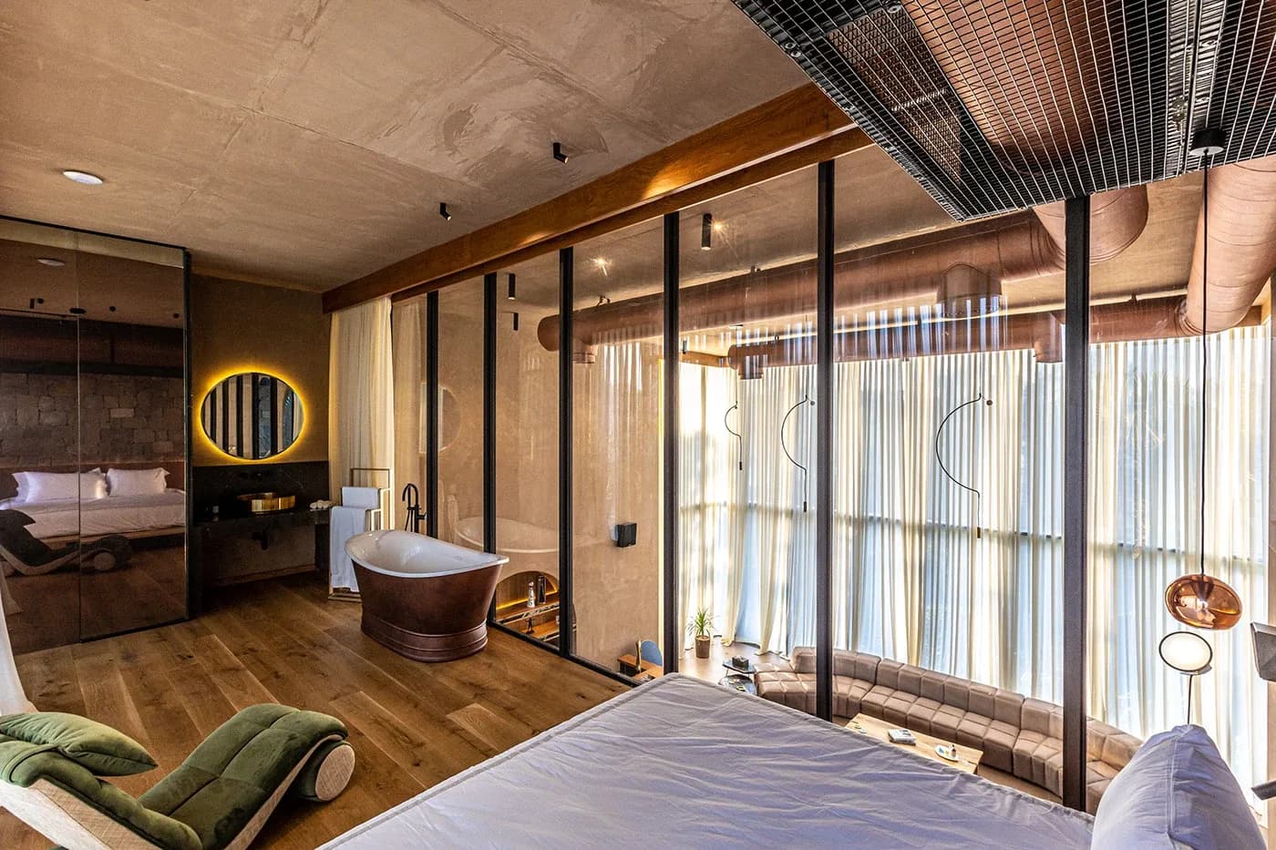 Bedroom suite with freestanding copper bathtub