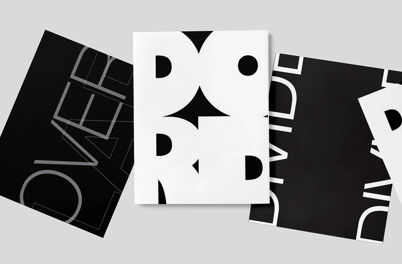 Three black and white typographic posters with cropped, oversized letterforms