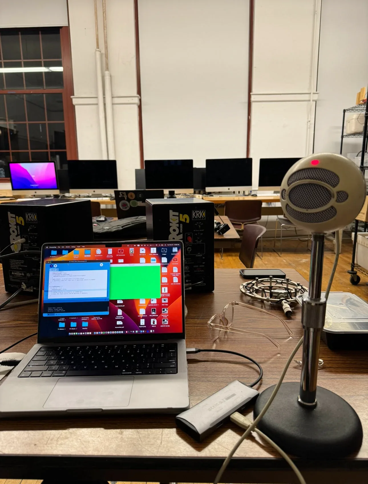 Microphone beside a laptop running the prototype in a studio