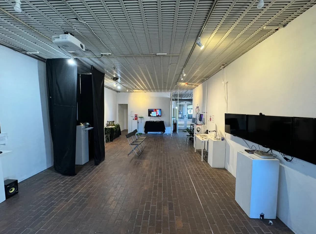 Gallery room at Boston Cyberarts with installations along the walls